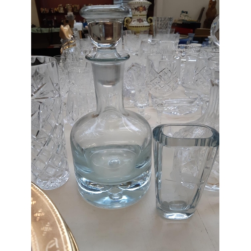 212 - A large collection of good quality glassware and cut crystal to include four decanters, spherical bo... 