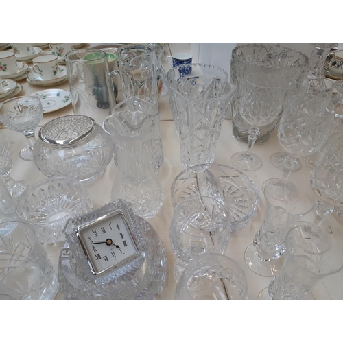 212 - A large collection of good quality glassware and cut crystal to include four decanters, spherical bo... 