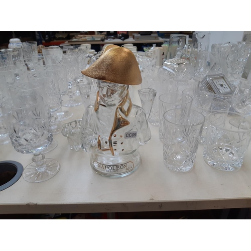 212 - A large collection of good quality glassware and cut crystal to include four decanters, spherical bo... 