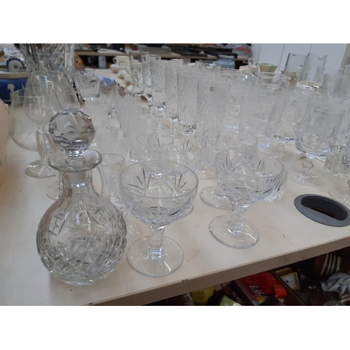 212 - A large collection of good quality glassware and cut crystal to include four decanters, spherical bo... 