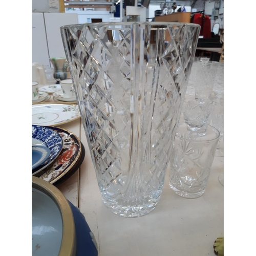 212 - A large collection of good quality glassware and cut crystal to include four decanters, spherical bo... 