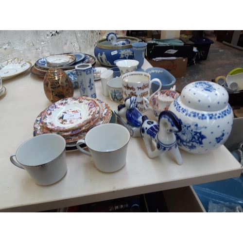 214 - A collection of assorted ceramics to include seven pieces of Wedgwood blue jasperware, Mason's Manda... 