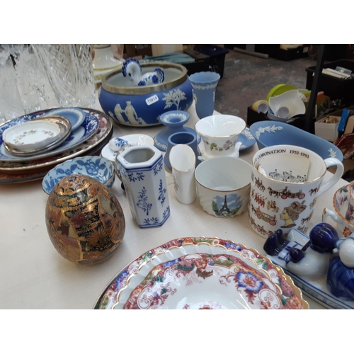 214 - A collection of assorted ceramics to include seven pieces of Wedgwood blue jasperware, Mason's Manda... 