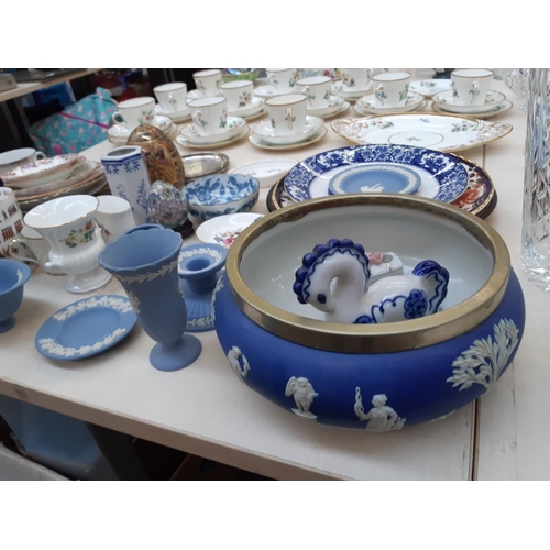 214 - A collection of assorted ceramics to include seven pieces of Wedgwood blue jasperware, Mason's Manda... 