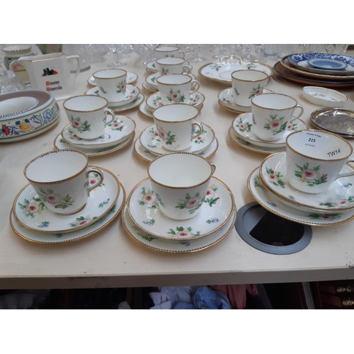 215 - A Victorian 35 piece porcelain tea set with hand painted floral motifs and gilded base and rim (see ... 