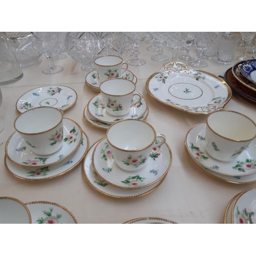 215 - A Victorian 35 piece porcelain tea set with hand painted floral motifs and gilded base and rim (see ... 