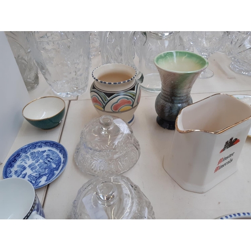 216 - A collection of various ceramics and glassware to include a Poole pottery posy ring vase, Sylvac pot... 