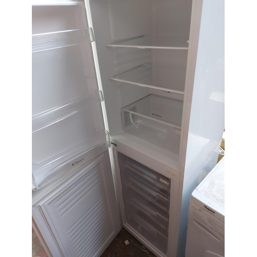 1002 - A large Candy upright fridge freezer