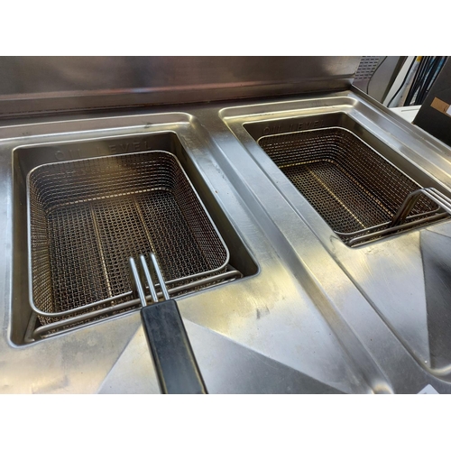 1008 - A Ggmgastro industrial stainless steel twin deep fat fryer with under storage measuring approx. 80cm