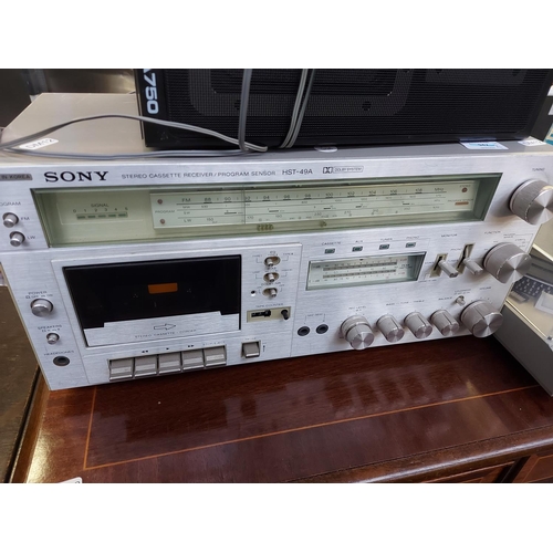 1048 - Four items to include a Sony HST49A tuner amp cassette player, a Technics SL-B2 two speed belt drive... 