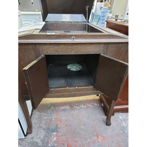 1049 - A vintage HMV gramophone cabinet