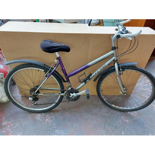 667 - A purple and grey Carrera ladies touring bike with quick release front wheel, gel saddle and 21 spee... 