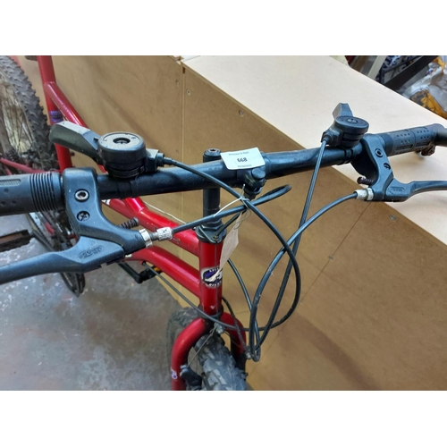 668 - A red Apollo Perpetual gents mountain bike with 21 speed Shimano gear system