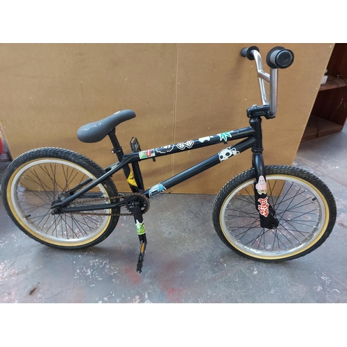 671 - A black Voodoo boys BMX customised for stunt riding