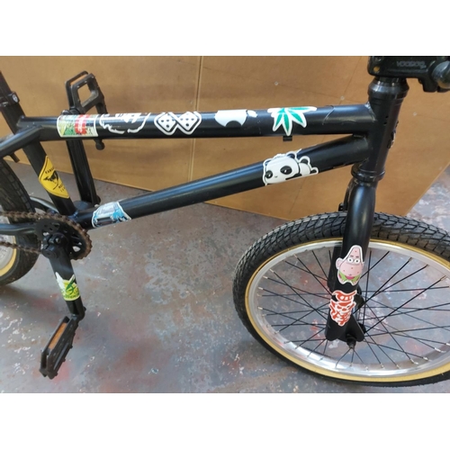 671 - A black Voodoo boys BMX customised for stunt riding