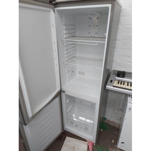 955 - A grey Zanussi upright fridge freezer