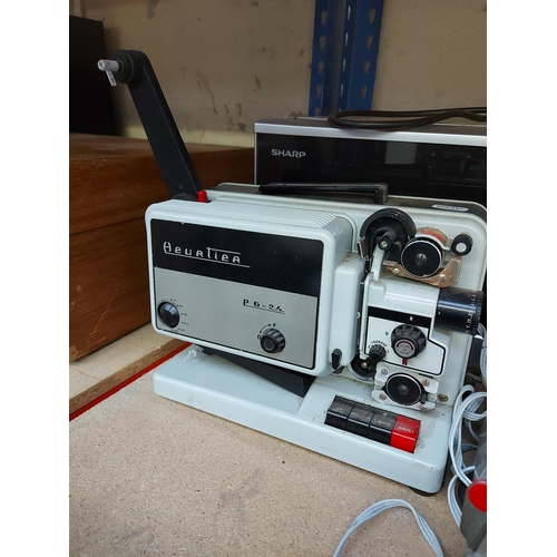 976 - Three items to include a Haninex HX300 slide projector, Heurtier P6 24 8mm cine film projector and a... 