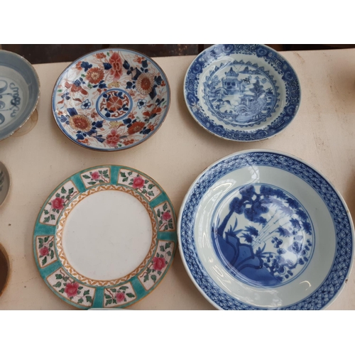 229 - A collection of 19th/20th century oriental ceramics to include a blue and white shallow dish with fl... 