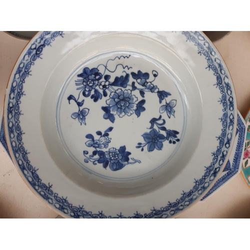 229 - A collection of 19th/20th century oriental ceramics to include a blue and white shallow dish with fl... 