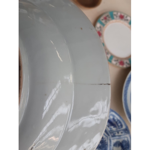 229 - A collection of 19th/20th century oriental ceramics to include a blue and white shallow dish with fl... 