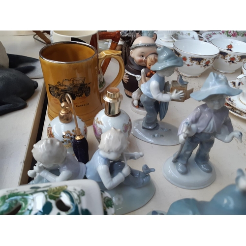 240 - A collection of assorted ceramics to include three West German Goebel figurines, four Lladro style f... 