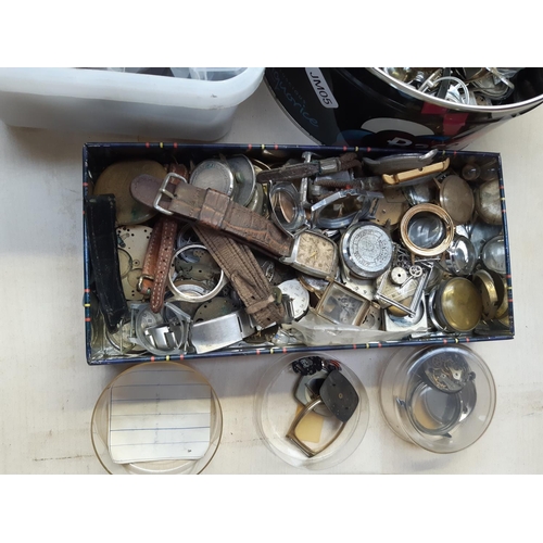 245 - A large collection of watchmakers parts and accessories to include springs, cases, movements, straps... 