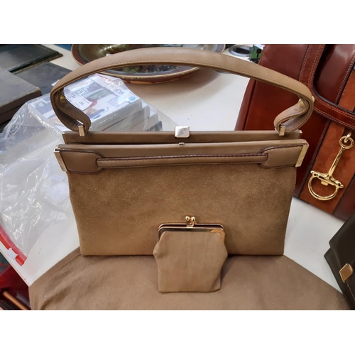 257 - Three good quality ladies handbags to include a Loewe green leather bag, Loewe suede bag and a Cavan... 