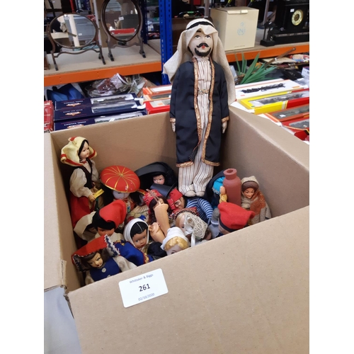 261 - A box containing a large collection of vintage dolls