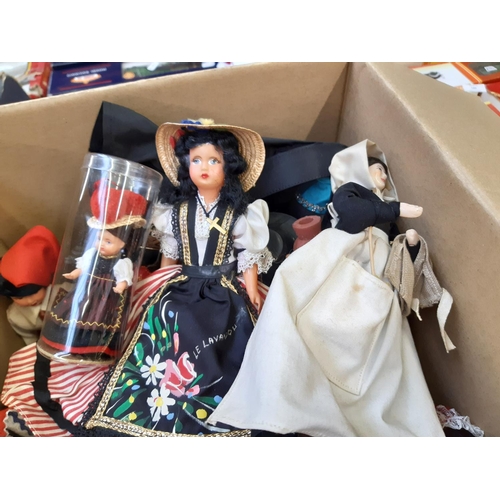 261 - A box containing a large collection of vintage dolls