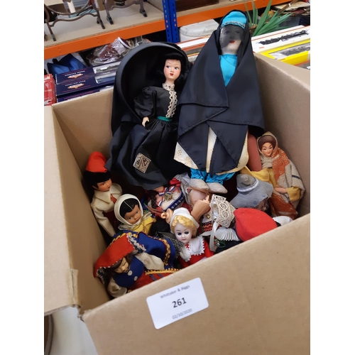 261 - A box containing a large collection of vintage dolls