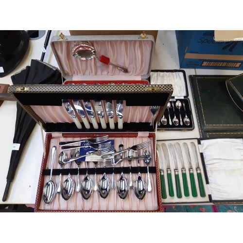 264 - Four cased cutlery sets to include a set of six Angora EPNS teaspoons, green handled butter knives e... 