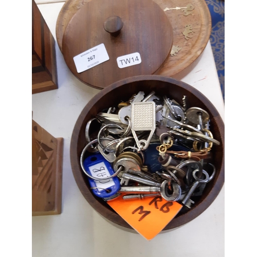 267 - Four pieces of treenware to include circular wall clock and three various lidded boxes