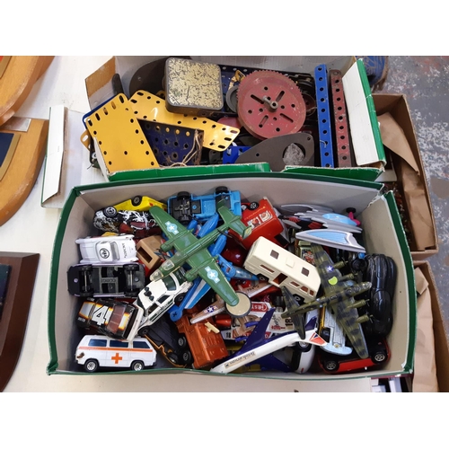 268 - Two boxes containing mixed items to include one of vintage Meccano and the other of die-cast vehicle... 