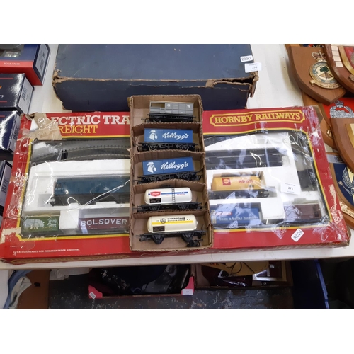 271 - A boxed Hornby electric freight train set together with two tankards and three wagons