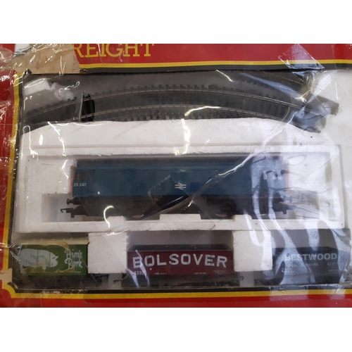 271 - A boxed Hornby electric freight train set together with two tankards and three wagons