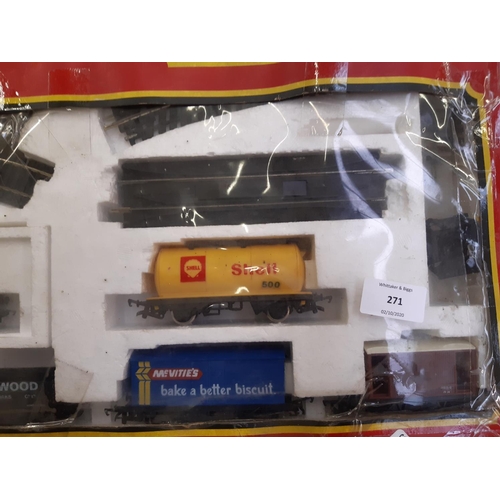 271 - A boxed Hornby electric freight train set together with two tankards and three wagons