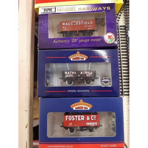 293 - Nine boxed model railway freight wagons to include Bachmann 20 ton brake van, Bachmann 8 plank wagon... 