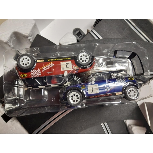 296 - A large collection of boxed toys to include Scalextric 200 model racing car set, Scalextric Mini Coo... 