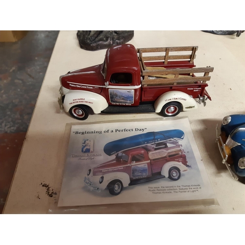 299 - Four American Ertl model pickups on mahogany display stand to include a 1947 Dodge, two 1940s Fords ... 