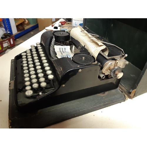 311 - A vintage black cased Olympia Progress typewriter