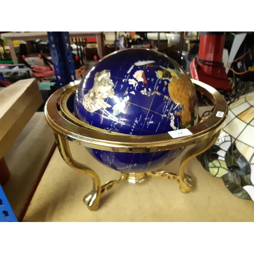 314 - A vintage style globe with inset semi precious stones and brass frame (see condition report)