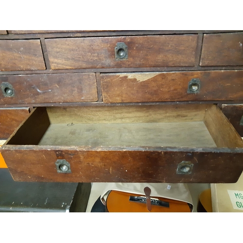 316 - An early 20th century wooden engineers cabinet with eleven drawers - measuring approx. 30cm high, 81... 