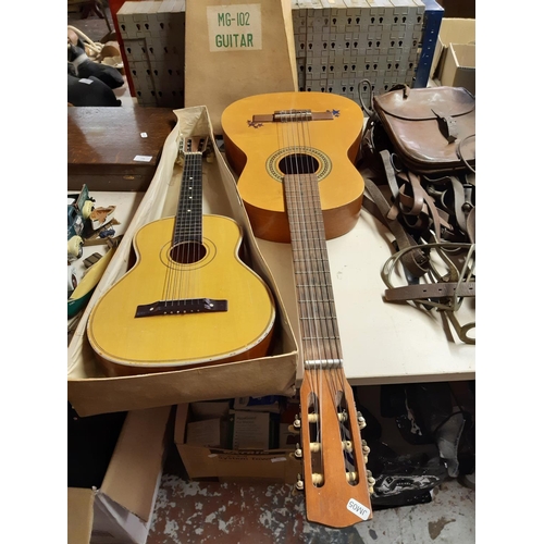 319 - Two child's acoustic guitars