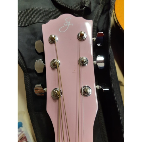 320 - Two child's acoustic guitar to include one pink (see condition report)