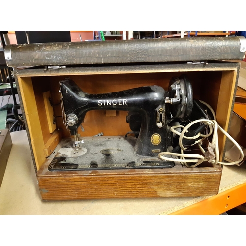 321 - A vintage cased Singer sewing machine