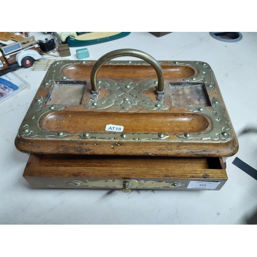 325 - A Victorian oak desk tidy with brass details, one drawer and bun feet - measuring approx. 31cm wide ... 