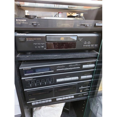 1054 - A Pioneer Hi-Fi system in cabinet comprising PLZ93 record player, twin tape deck, tuner amp with gra... 