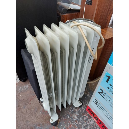 1053 - A grey and white electric radiator and a Neostar electronics dehumidifier