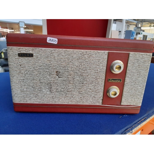 340 - A 1950s cream and red Pilot portable record player