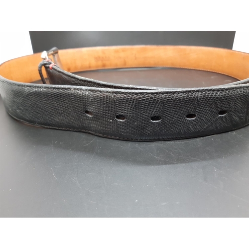 351 - A good quality Italian Billionaire black iguana skin men's belt - measuring approx. 105cm